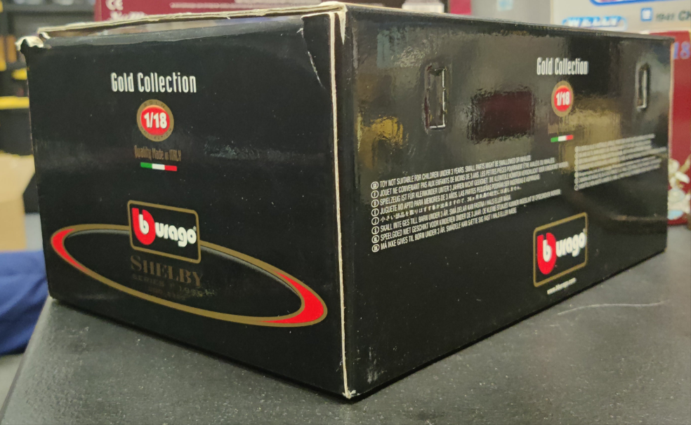 Burago Shelby Series 1 1999 échelle 1/18 - Bburago Gold - Zamak - Boîte D'origine